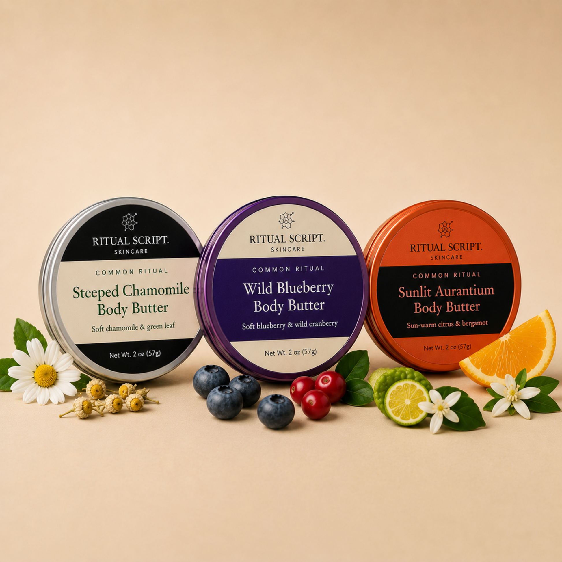 All three Common Ritual body butters together — Steeped Chamomile in silver, Wild Blueberry in purple, and Sunlit Aurantium in coral