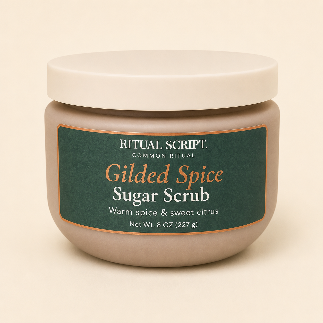 Gilded Spice Sugar Body Scrub in an 8 oz jar with a cream lid and forest green label reading warm spice and sweet citrus