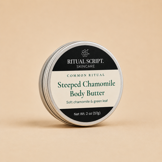 Steeped Chamomile Body Butter in a 2 oz silver tin with a cream and black label reading soft chamomile and green leaf
