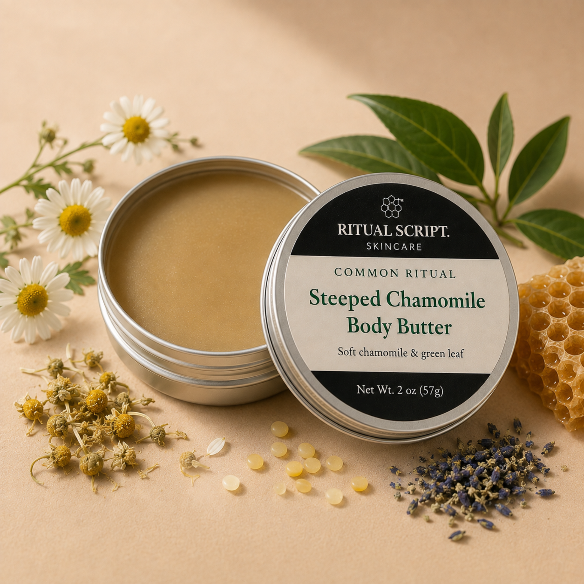 Open tin of Steeped Chamomile Body Butter showing its warm tan texture, styled with chamomile flowers, hemp seeds, and green leaves
